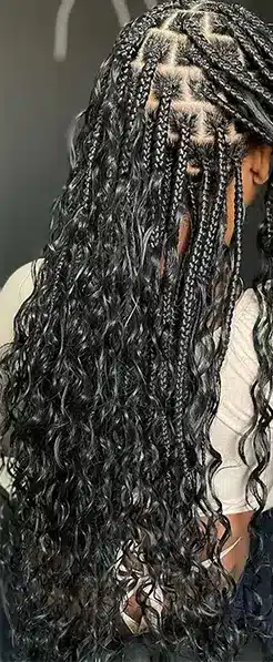 Boho braids with curls in human hair on model, soft natural texture, protective hairstyle